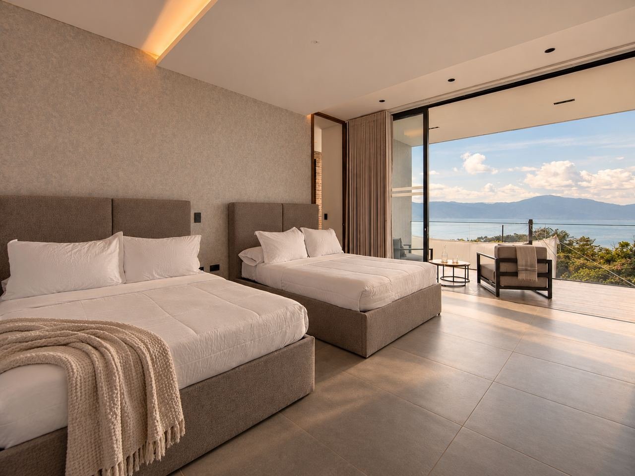 Bedroom with floor-to-ceiling window and valley views